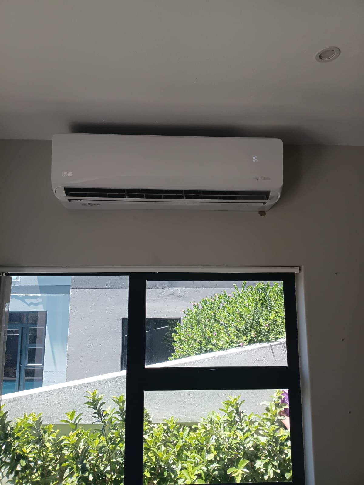 Indoor air conditioner installed above a window in Gauteng