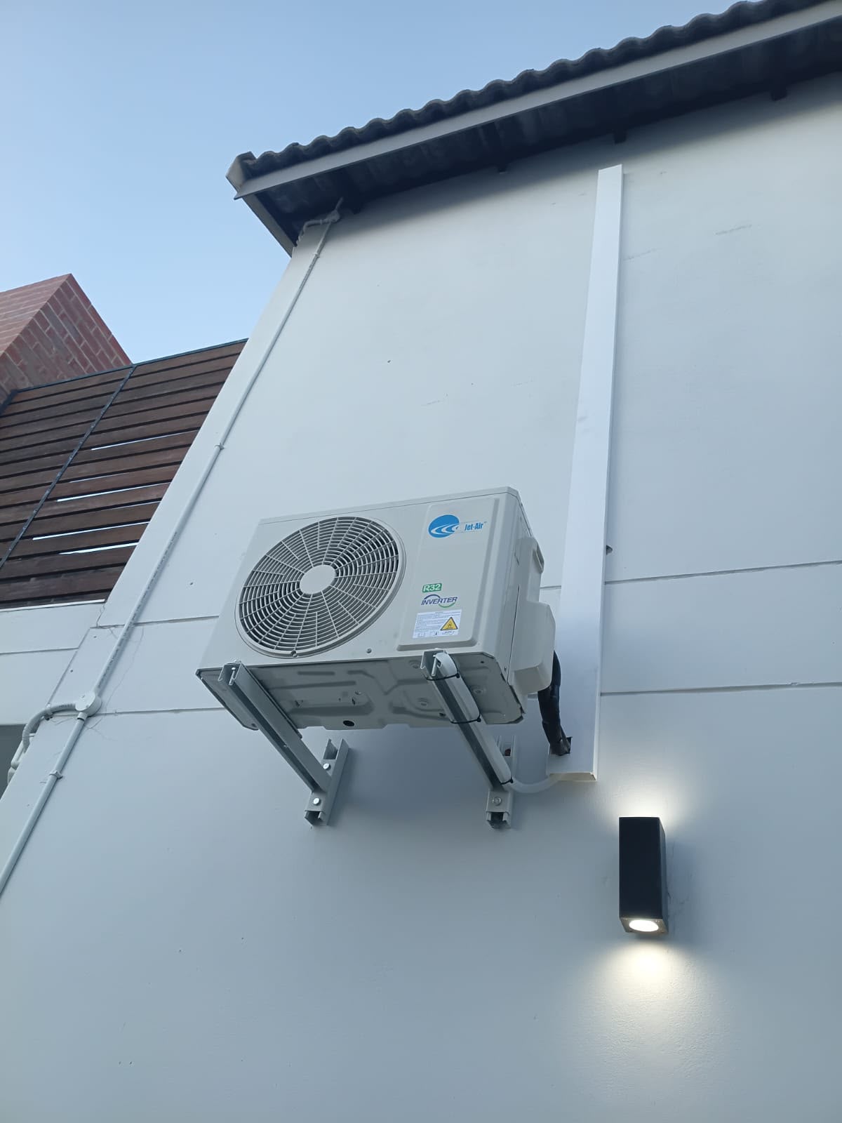 Outdoor air conditioner mounted on a home's exterior wall in Gauteng