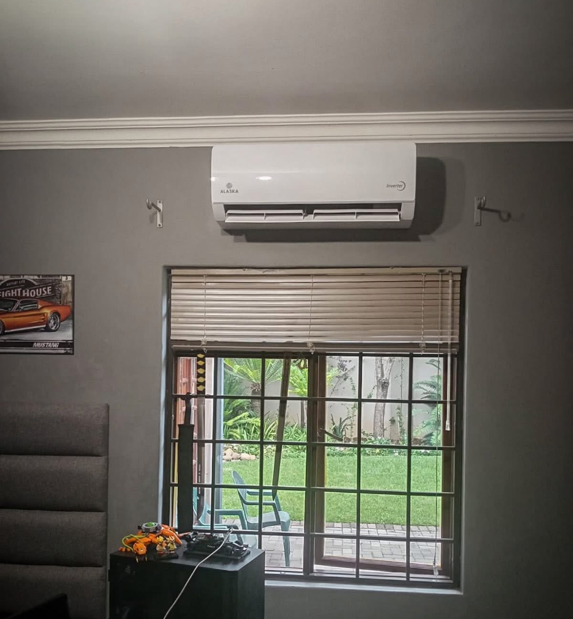 Alaska Air Conditioner installed above a window in a family lounge