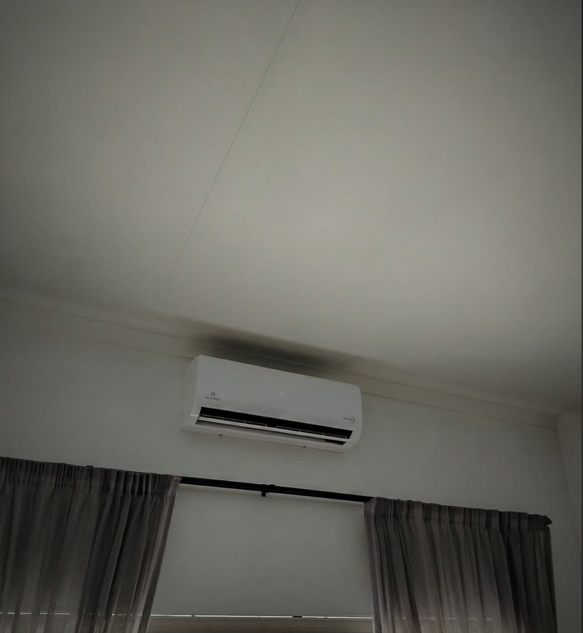 Alaska Air Conditioner installed above bedroom curtains