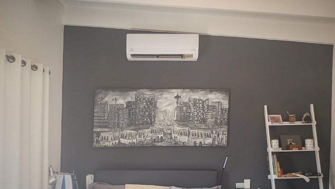 Alaska aircon installation above a feature wall