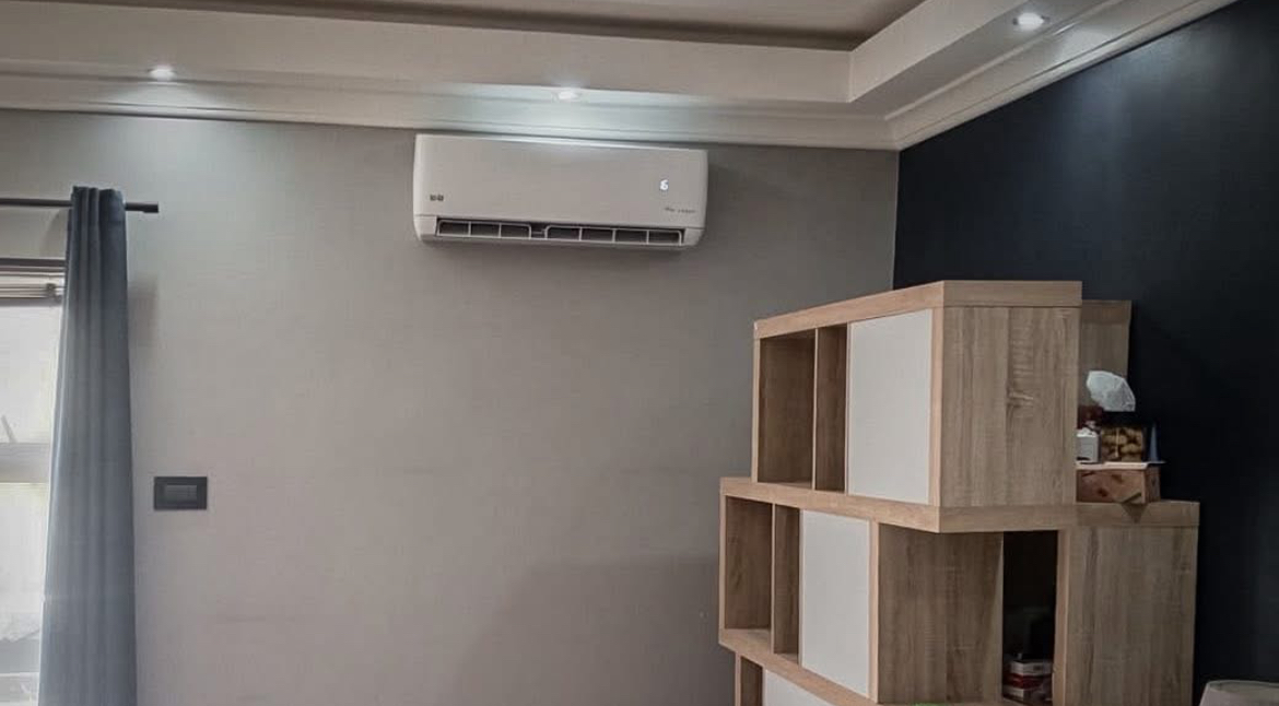 Wall-mounted aircon installed in a contemporary lounge