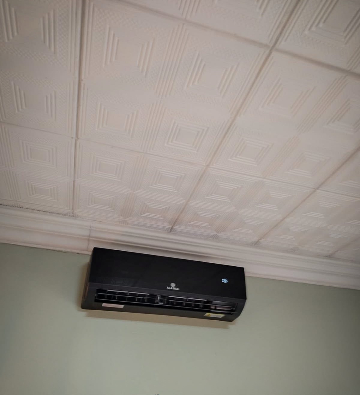 Black Alaska Air Conditioner installed in a modern lounge
